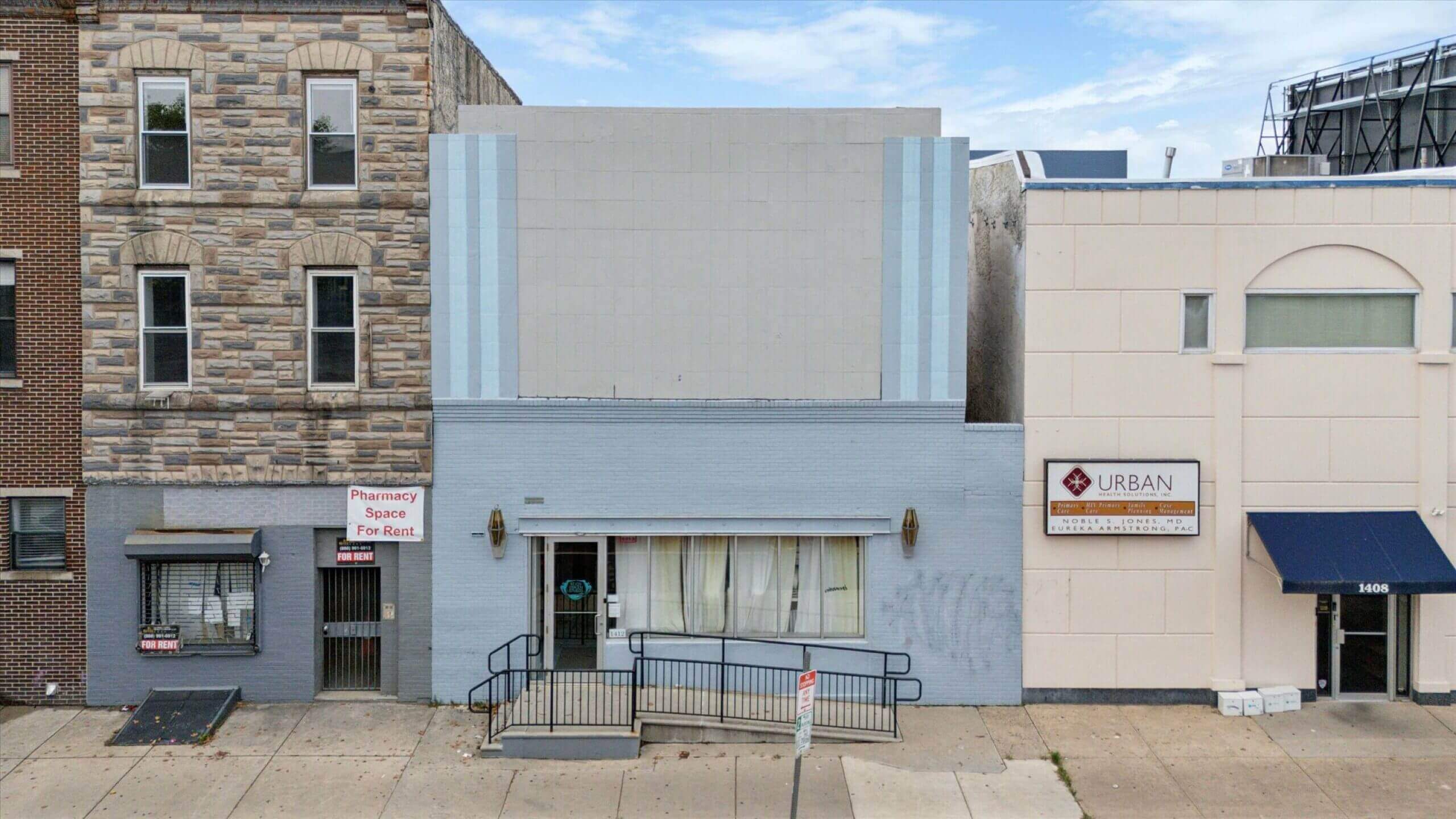 Row of urban buildings with storefronts.